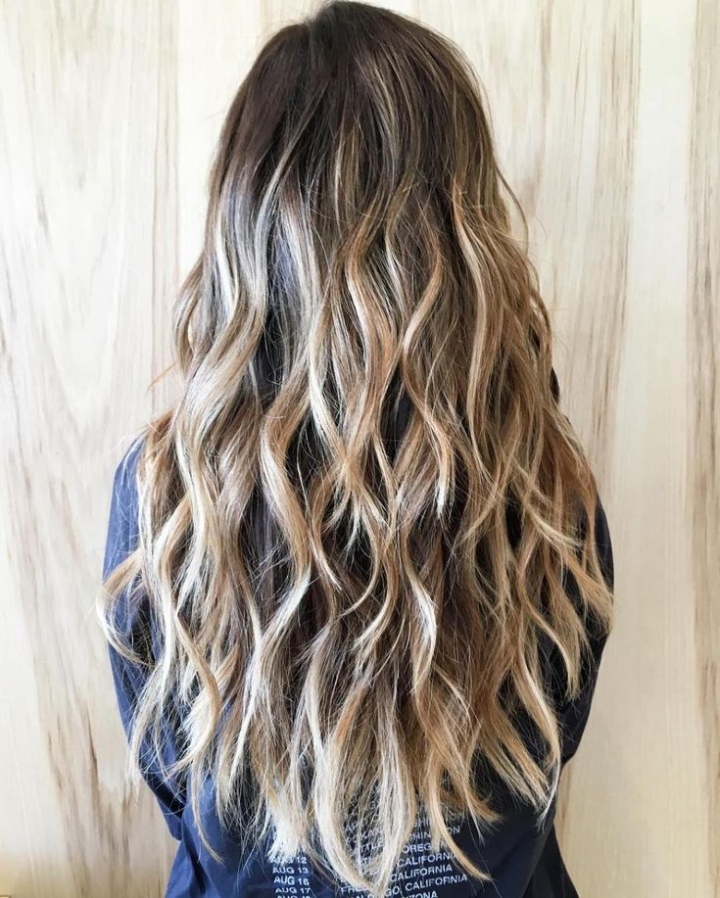 Flowing Waves: 10 Stunning Haircut Styles For Long Wavy Hair